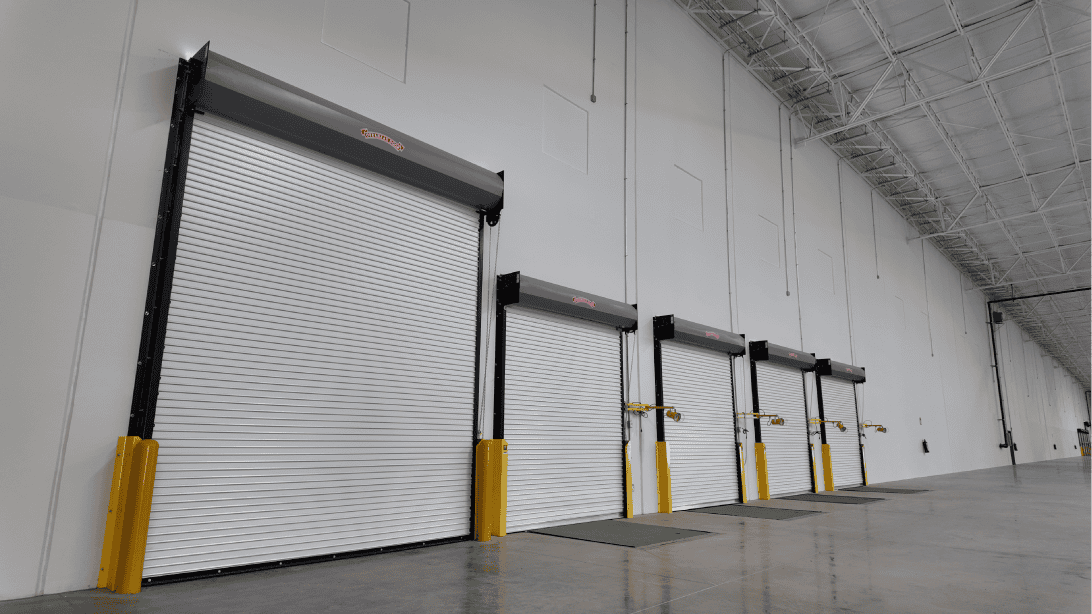 mexico-industrial-real-estate-costs-timing-012 Row of loading dock doors inside a Mexican industrial facility, representing regional rent and space variation across industrial markets.